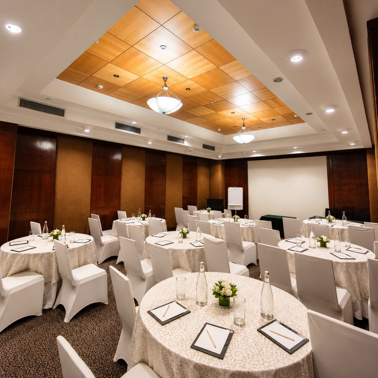 The Windsor banquet laid with round tables at The Hans, New Delhi